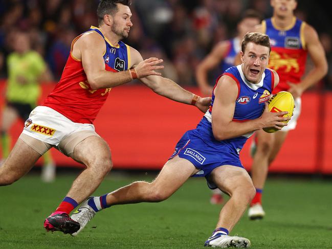 Lions defender Conor McKenna (left) chases the Western Bulldogs’ Jack Macrae. Picture: Michael Klein