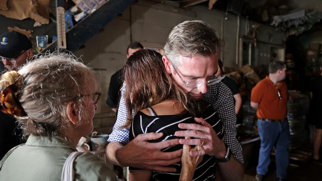 NSW Premier Dominic Perrottet consoles the owner of Lismore’s Mega Choice Discount Store, Jess Solanki on March 5 last year. Picture: Toby Zerna