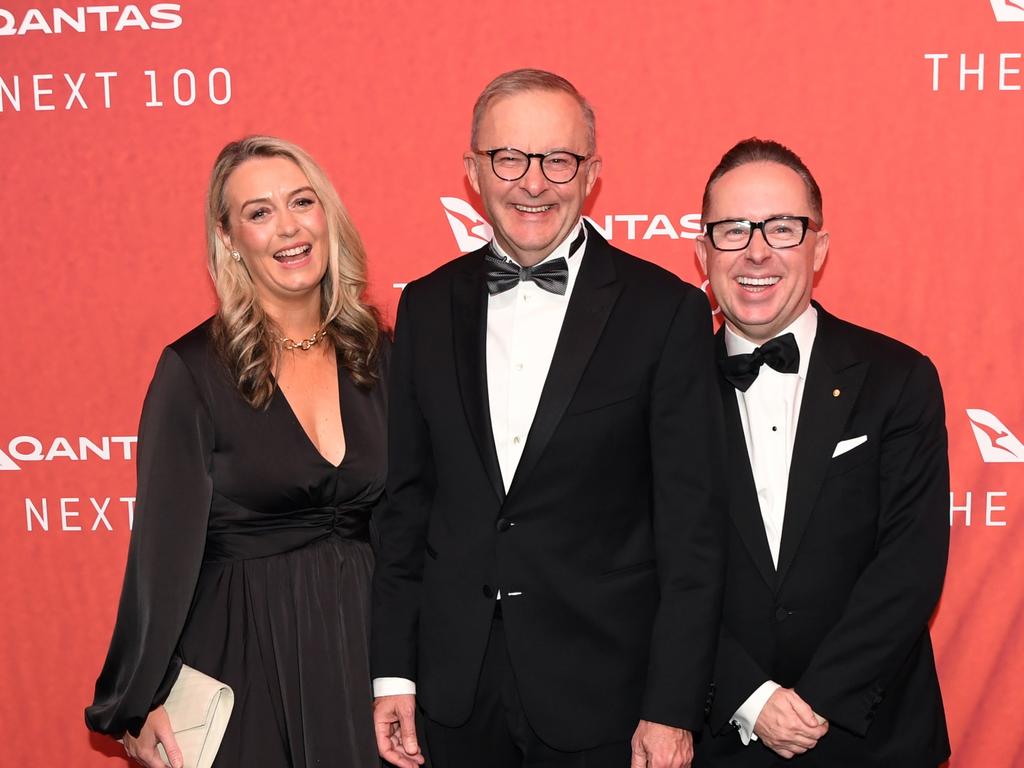 SYDNEY, AUSTRALIA - MARCH 31: Australian Prime Minister Anthony Albanese (C) stands with his partner Jodie Haydon and Qantas CEO Alan Joyce as they attend the Qantas 100th Gala Dinner at Jetbase 96 hangar at Sydney's International Airport on March 31, 2023 in Sydney, Australia. (Photo by James D. Morgan/Getty Images)