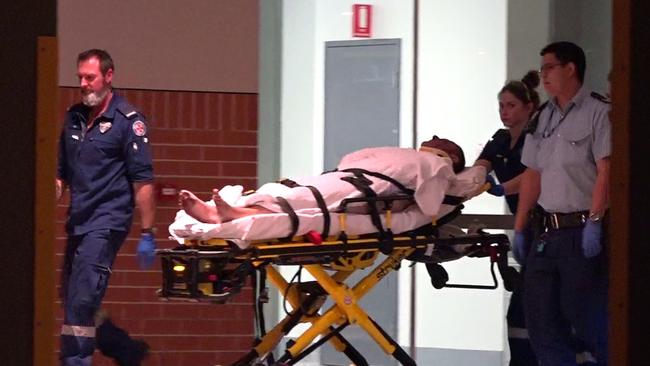 Paramedics assist a man stabbed during the incident at Kogarah on Thursday. Picture: TNV