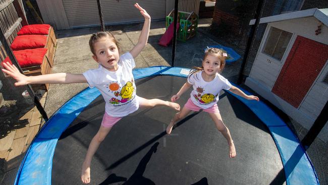 Five-year-old twins Aria and Isabelle on a trampoline. Picture: Jay Town