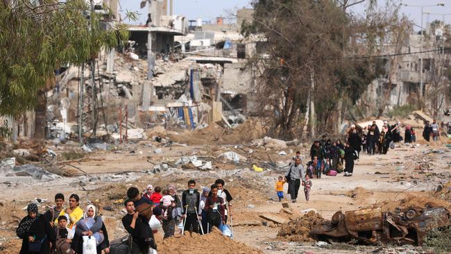 Palestinians leaving the north walk through the Salaheddine road in the Zeitoun district on the southern outskirts of Gaza City on November 25, 2023, as a truce between Israel and Hamas that Qatar helped negotiate took hold. Picture: AFP