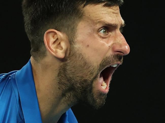 MELBOURNE, AUSTRALIA - JANUARY 21: Novak Djokovic of Serbia celebrates winning match point against Carlos Alcaraz of Spain in the Men's Singles Quarterfinal match during day 10 of the 2025 Australian Open at Melbourne Park on January 21, 2025 in Melbourne, Australia. (Photo by Clive Brunskill/Getty Images)