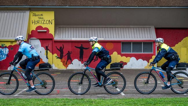 First Constable Chris Plumridge, Senior Constable Ben McDonald and Sergeant Peter Guerin ride through Richmond's housing commission grounds. Picture: Jake Nowakowski