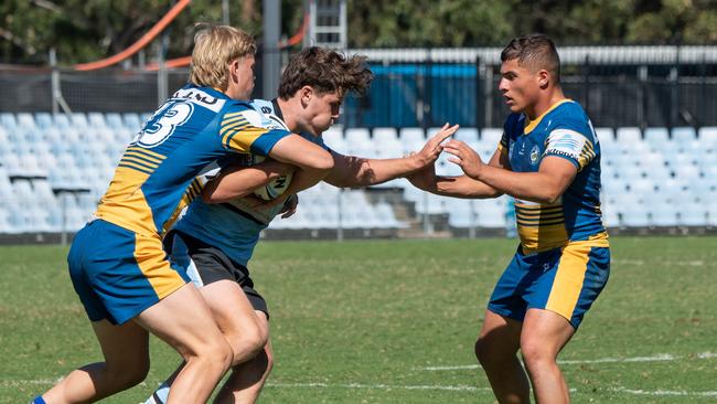 Stop right there: Parramatta meet a Cronulla opponent. Picture: Monique Harmer
