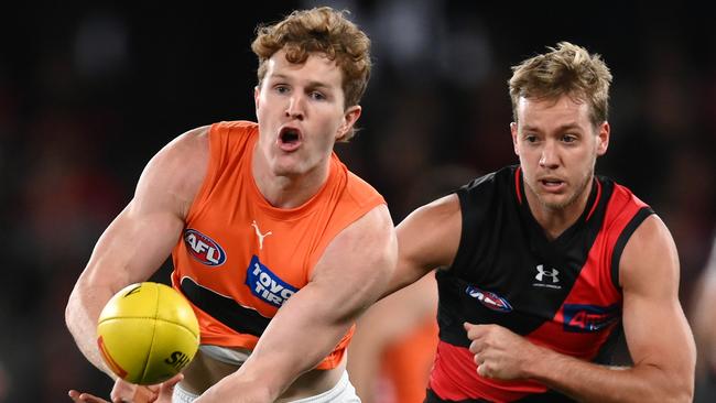 Giant Tom Green and Bomber Darcy Parish go head to head. Picture: Quinn Rooney/Getty Images