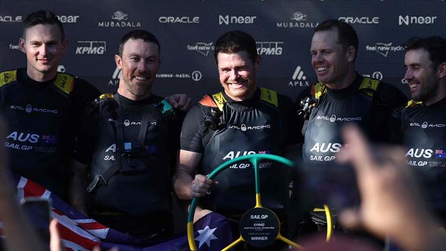 Australia, led by Tom Slingsby, celebrate victory at SailGP Sydney. Photo by DAVID GRAY / AFP)