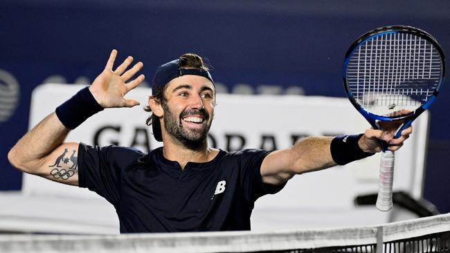 Jordan Thompson celebrates the victory. Photo by ALFREDO ESTRELLA / AFP