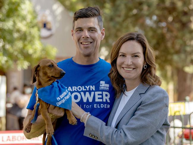 Former Liberal MP for Elder Carolyn Power with her husband Brad Power and their dog Napoleon at Edwardstown Primary School. She has pulled out. Picture: Naomi Jellicoe