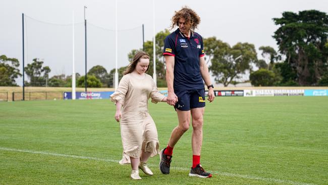 Ben Brown with his cousin Grace,17, who is now in remission following two battles with Leukaemia. Brown will shave his head on Saturday at the Demonâ&#128;&#153;s Family Day to raise money to support children with cancer as well as their families. Photo courtesy of David McPherson/Melbourne Football Club