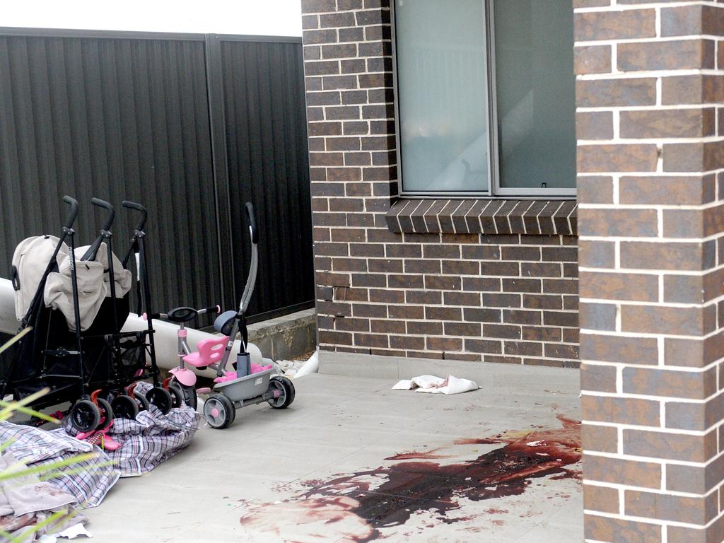 The bloodied crime scene at the doorstep of a neighbouring property where Mejid Hamzy stumbled after being shot. Picture: Jeremy Piper