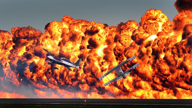 The sky over Avalon Airport lit up with flames as Tinstix of Dynamite flew over the airspace during their finale to the Melbourne International Airshow. Picture: Alex Coppel