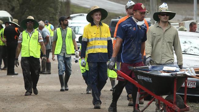 Mud Army volunteers at Logan Reserve during the flood clean up in Logan, after Cyclone Debbie. PHOTO: Jono Searle.