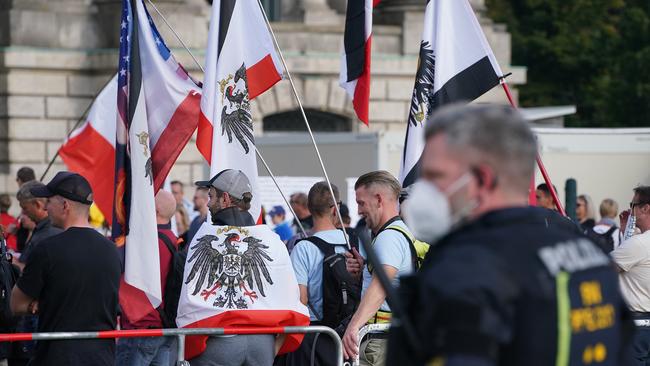 Riot police observe far-right protesters gathered outside the Reichstag in Berlin yesterday. Picture: Getty Images