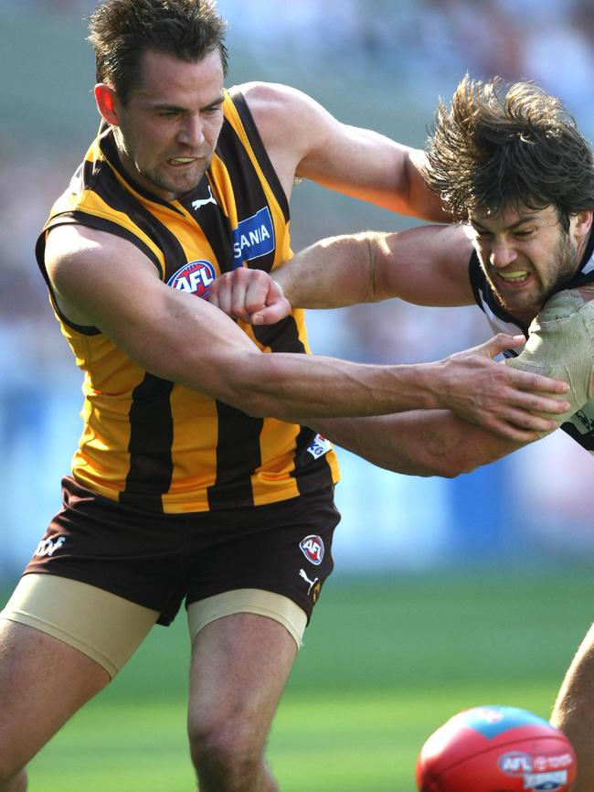 Luke Hodge contests with Max Rooke during the 2008 grand final. Picture: HWT