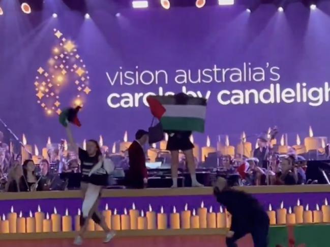 Christmas Eve 2023 Carols by Candlelight at the Sidney Myer Music Bowl in Melbourne has been interrupted by pro-Palestine protesters storming the stage. Picture: @JessicaWestcot8/Twitter