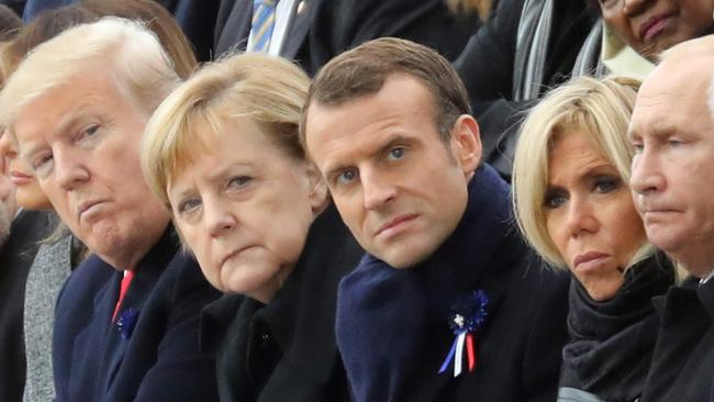 US President Donald Trump, German Chancellor Angela Merkel, French President Emmanuel Macron and his wife Brigitte Macron, Russian President Vladimir Putin at the Arc de Triomphe Armistice ceremony in Paris.