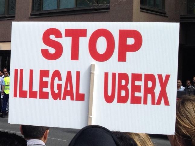 Hundreds of angry taxi drivers and owners rallied outside NSW Parliament in Macquarie St today calling on the state government to ban ridesharing company uberX. Picture: Jim O'Rourke