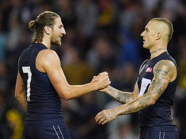 Marcus Bontempelli of Victoria and Dustin Martin celebrate the win during the Charity State of Origin for Bushfire Relief match between Victoria and All Stars at Marvel Stadium in Melbourne, Friday, February 28, 2020. (AAP Image/Michael Dodge) NO ARCHIVING, EDITORIAL USE ONLY