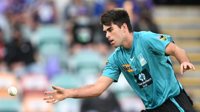 Xavier Bartlett of the Heat fields the ball during a Men's Big Bash League match. Photo: Steve Bell/Getty Images.