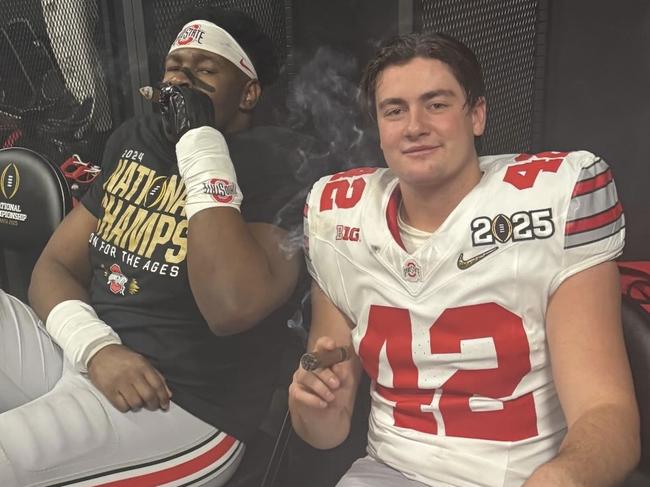 Joe McGuire celebrates his team’s recent win with a cigar. Pic: Instagram