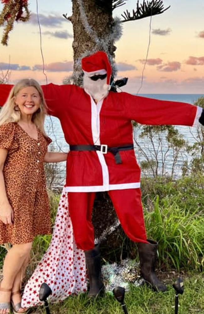 Doona Toohey with a Santa statue: Point Vernon 2023 - Fraser Coast.