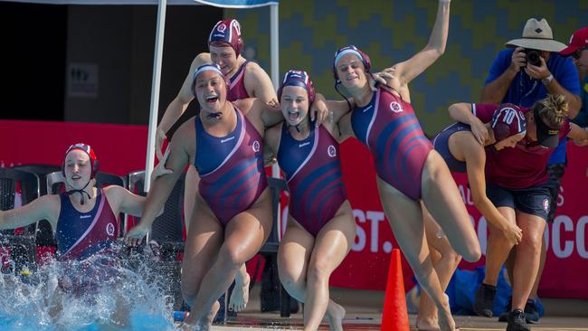 Taafili Taoso, middle, leaps into the pool.