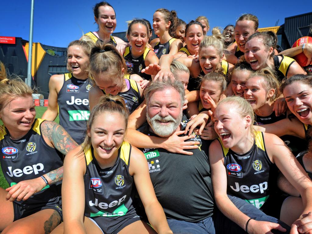 Richmond father figure Neil Balme with the Tigers’ AFLW players at Punt Road Oval. Picture: Andrew Henshaw