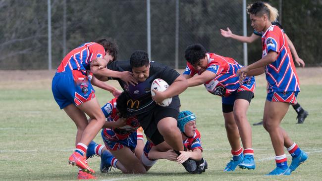 The Springfield player tries to break through Redbank Plain’s defence in the under-14 semi-final. Picture: Gary Reid