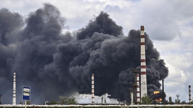 Smoke rises from an oil refinery after an attack outside the city of Lysychansâk in the eastern Ukranian region of Donbas. Picture: AFP