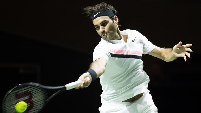 Roger Federer plays a forehand return during his men's singles match.