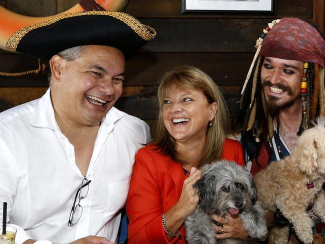 Gold Coast Mayor Tom Tate with Deputy Mayor Councillor Donna Gates received a  a visit from Captain Jack Sparrow impersonator   Brady Mayer  and his dogs Pistol & Boo dogs and  bar wench MArie Stirling  at the  Boat Works Galley restaurant  in Coomera. Picture: JERAD WILLIAMS