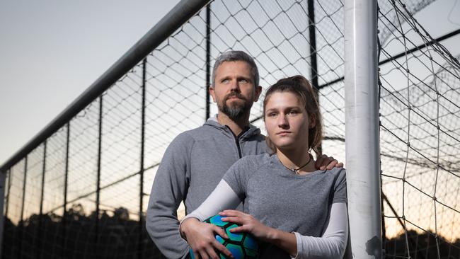 ‘Guys have bigger lungs, hearts and muscles’: rising soccer star ‘Lina’, 15 (not her real name), with her father. Picture: Peter Mathew