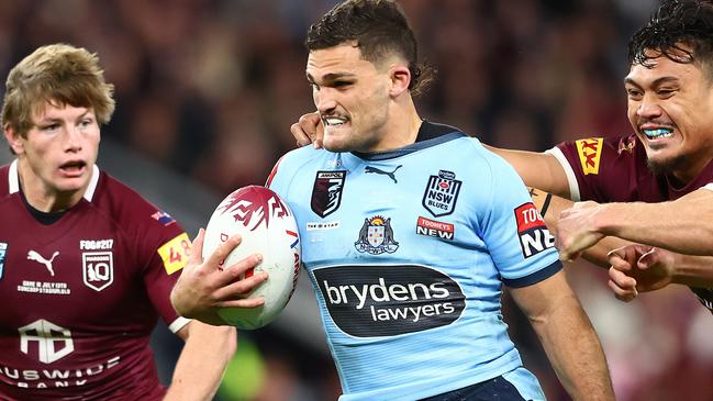 BRISBANE, AUSTRALIA - JULY 13:  Nathan Cleary of the Bluesis tackled during game three of the State of Origin Series between the Queensland Maroons and the New South Wales Blues at Suncorp Stadium on July 13, 2022, in Brisbane, Australia. (Photo by Chris Hyde/Getty Images)