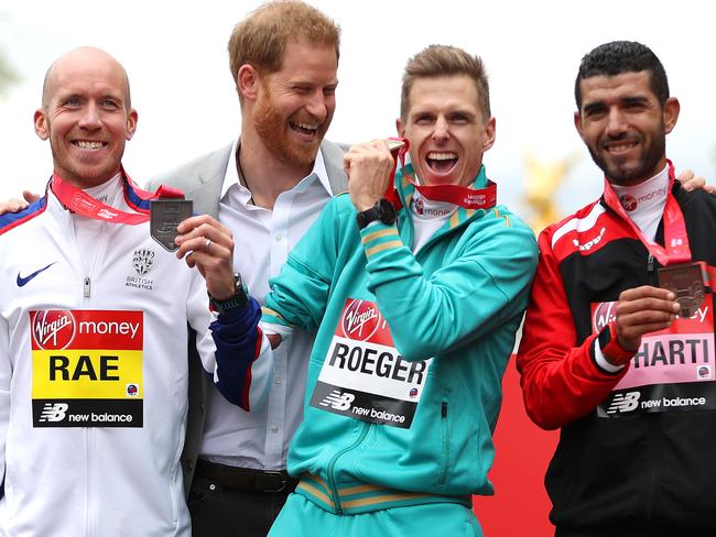Prince Harry, Duke of Sussex, made a surprise appearance at the London Marathon — which incorporated the World Para Championships — to hand out medals to the winners. In the T46 class, medals were handed out to Derek Rae of Great Britain (second), Michael Roger of Australia (first), and Abdehadi El Harti of Morocco (third). Picture: Naomi Baker/Getty Images.