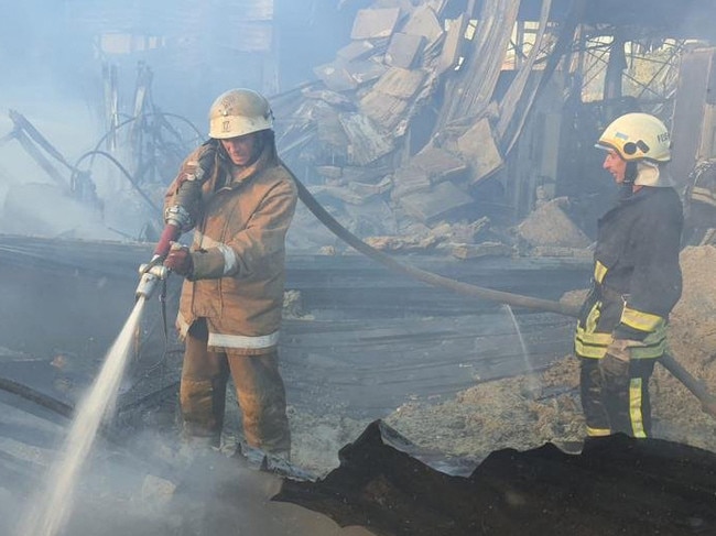 A firefighter at the shocking scene of the mall attack. Picture: Ukraine's State Emergency Service / AFP