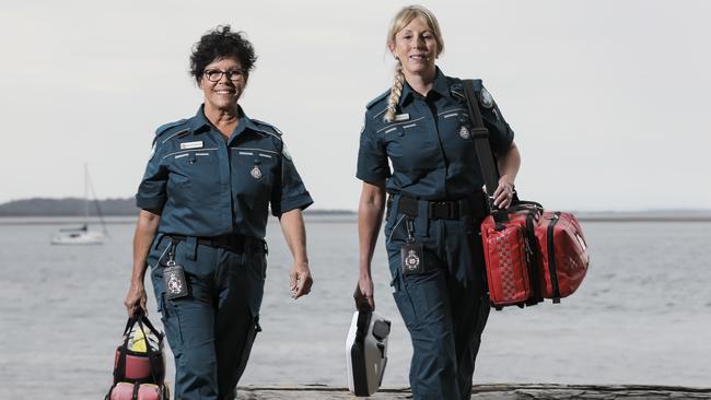 Beverly Geronimos, 59, and Vikki Harvey, 50, are volunteer paramedics, who are on-call whenever they are home on Coochiemudlo Island. Picture: Mark Cranitch.