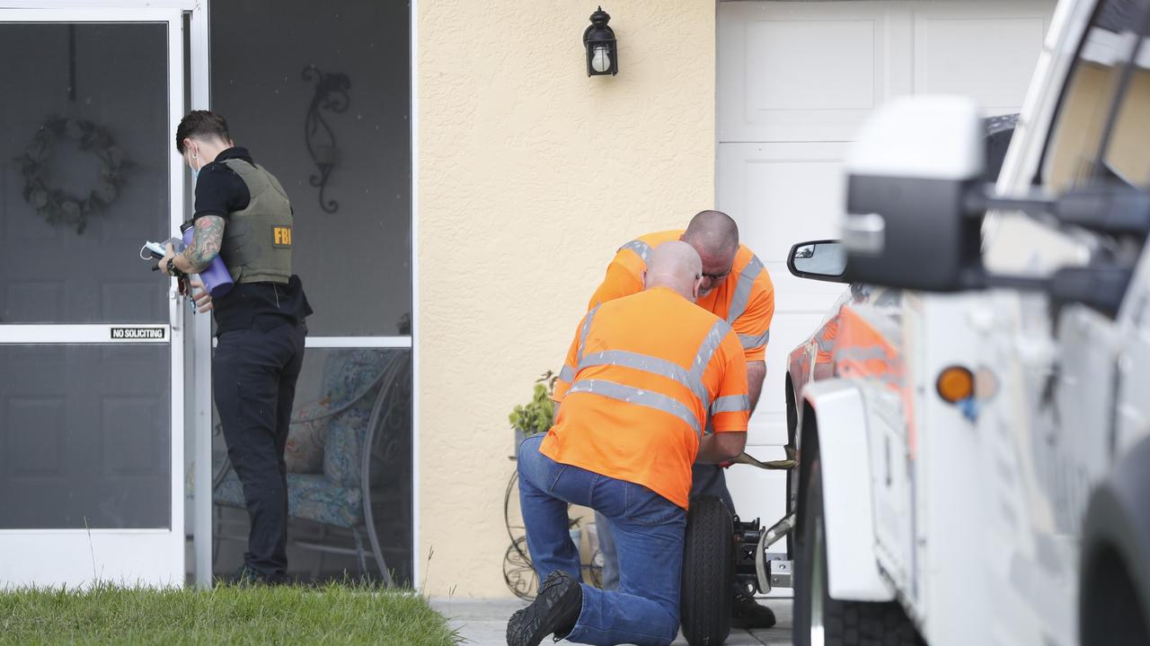 Tow truck operators prepare to haul away a Ford Mustang belonging to Brian Laundrie at his family home on September 20. Picture: Octavio Jones/Getty Images/AFP