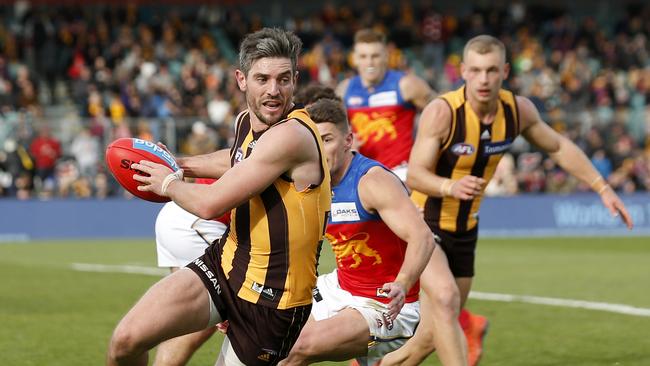 Hawk Ricky Henderson runs with the ball during the AFL match between the Hawthorn Hawks and the Brisbane Lions in Launceston. Picture: DARRIAN TRAYNOR/GETTY