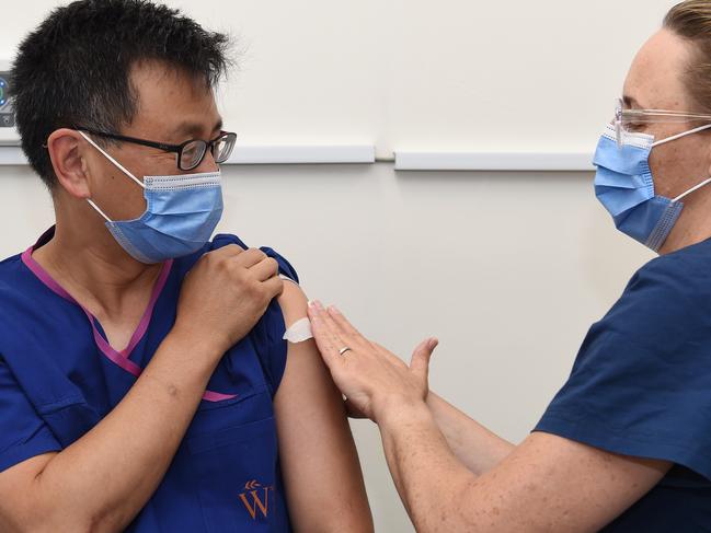 Victorian deputy chief health officer Allan Cheng received the first jab Friday morning – the Pfizer vaccine at the Alfred Hospital. Picture: Josie Hayden