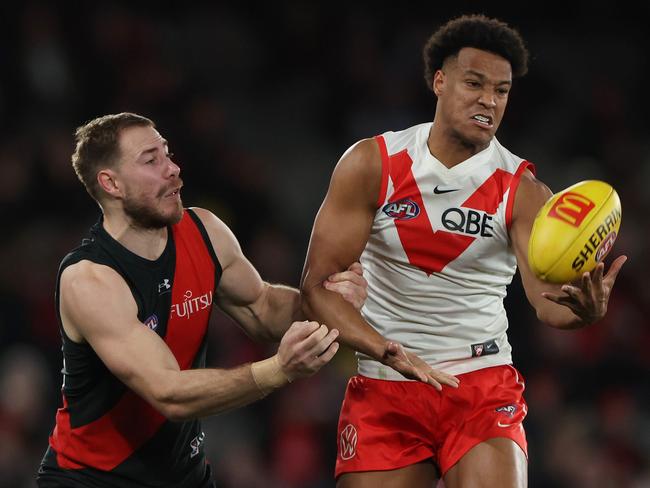 MELBOURNE, AUSTRALIA - AUGUST 16: Joel Amartey of the Swans and Ben McKay of the Bombers contest the ball during the round 23 AFL match between Essendon Bombers and Sydney Swans at Marvel Stadium, on August 16, 2024, in Melbourne, Australia. (Photo by Daniel Pockett/Getty Images)