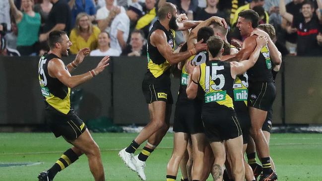 The Tigers celebrate on the siren. Picture: Annette Dew