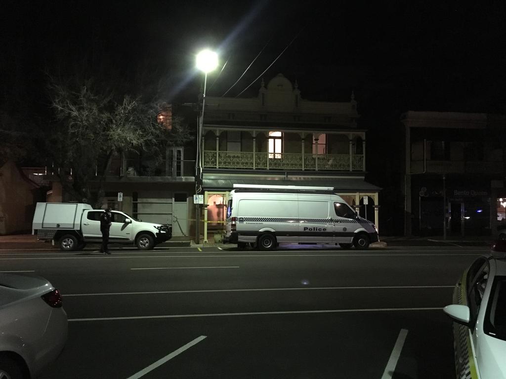 Police and forensic services at the home in Sturt St, in the Adelaide CBD. Picture: Mitch Mott