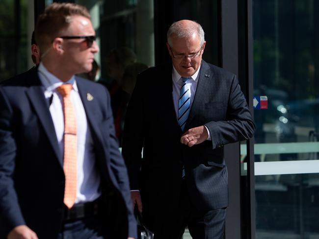 Australian Prime Minister Scott Morrison leaves the Meeting of the Council of Australian Governments (COAG) at Bankwest Stadium in Sydney, Friday, March 13, 2020. The nation's leaders are only 