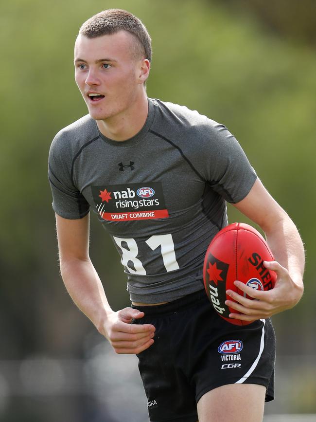 Cox in action. Pictures: Dylan Burns/AFL Photos/Michael Klein