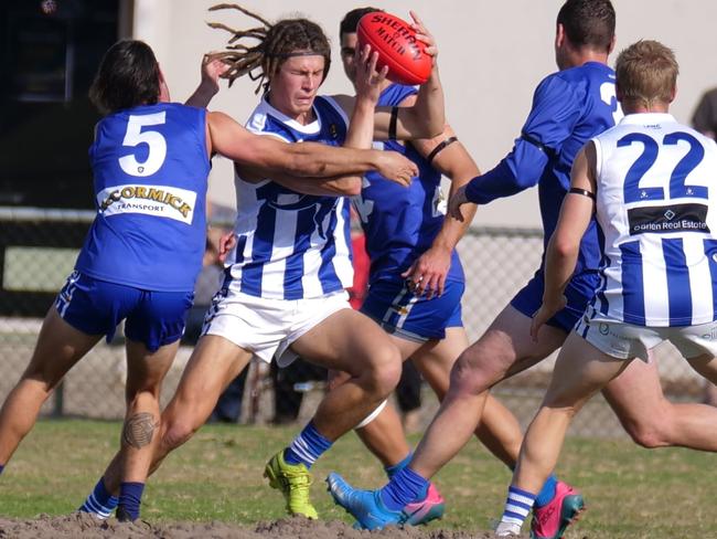 Langwarrin’s Jai Culley finds his way through traffic. Picture: Paul Churcher