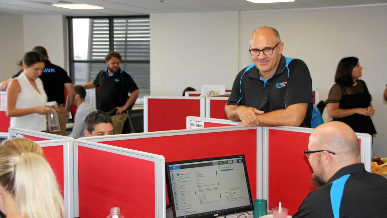 HTW Sunshine Coast director Stuart Greensill with the team at the new premises in Maroochydore. Picture: Erle Levey