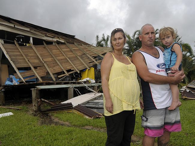 News 3.2.11 BCM Tully residents Peter and Debra Ross with son Robert out side their McQuillen st house severely damaged by cyclone yasi. Pic John Wilson Story Greg Stoltz