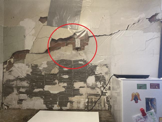 A Melbourne woman is trapped in a home that is cracking and has holes in the wall which she has fixed with contact. Picture: Supplied