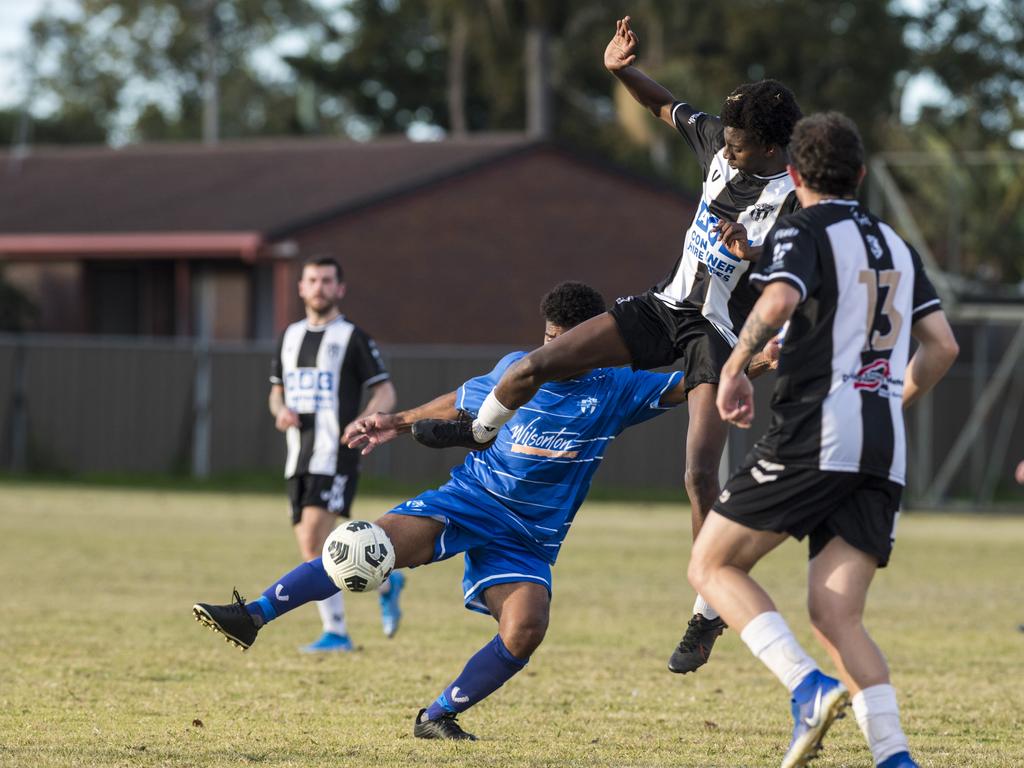Willowburn player Ada Harerimana (right) attempts to stop a volley from Patrick Maneikera of Rockville Rovers in Toowoomba Football League Premier Men round 13 at Captain Cook reserve, Sunday, June 20, 2021. Picture: Kevin Farmer